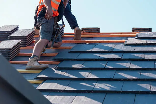 Professional roofing company adding concrete tile roofing in California